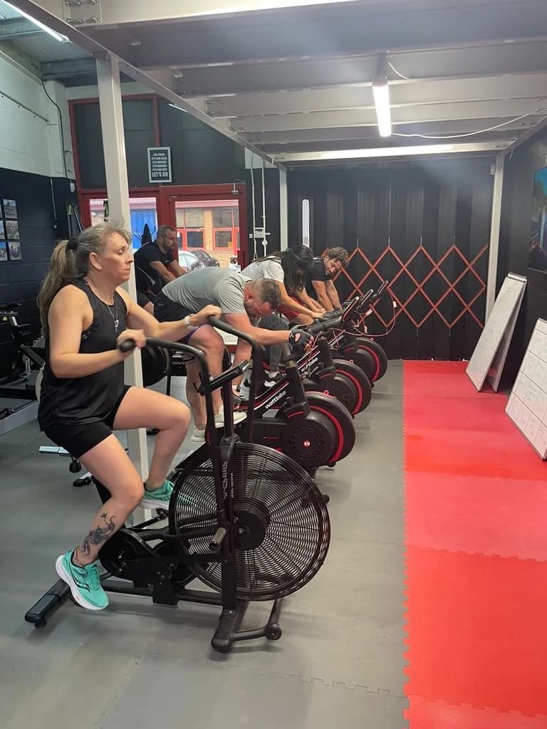 Challenge Life members training together on rowing machines
